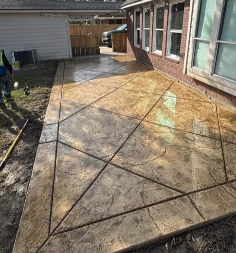 Stamped concrete patio installation in Houston, TX by Castanon Concrete Designs