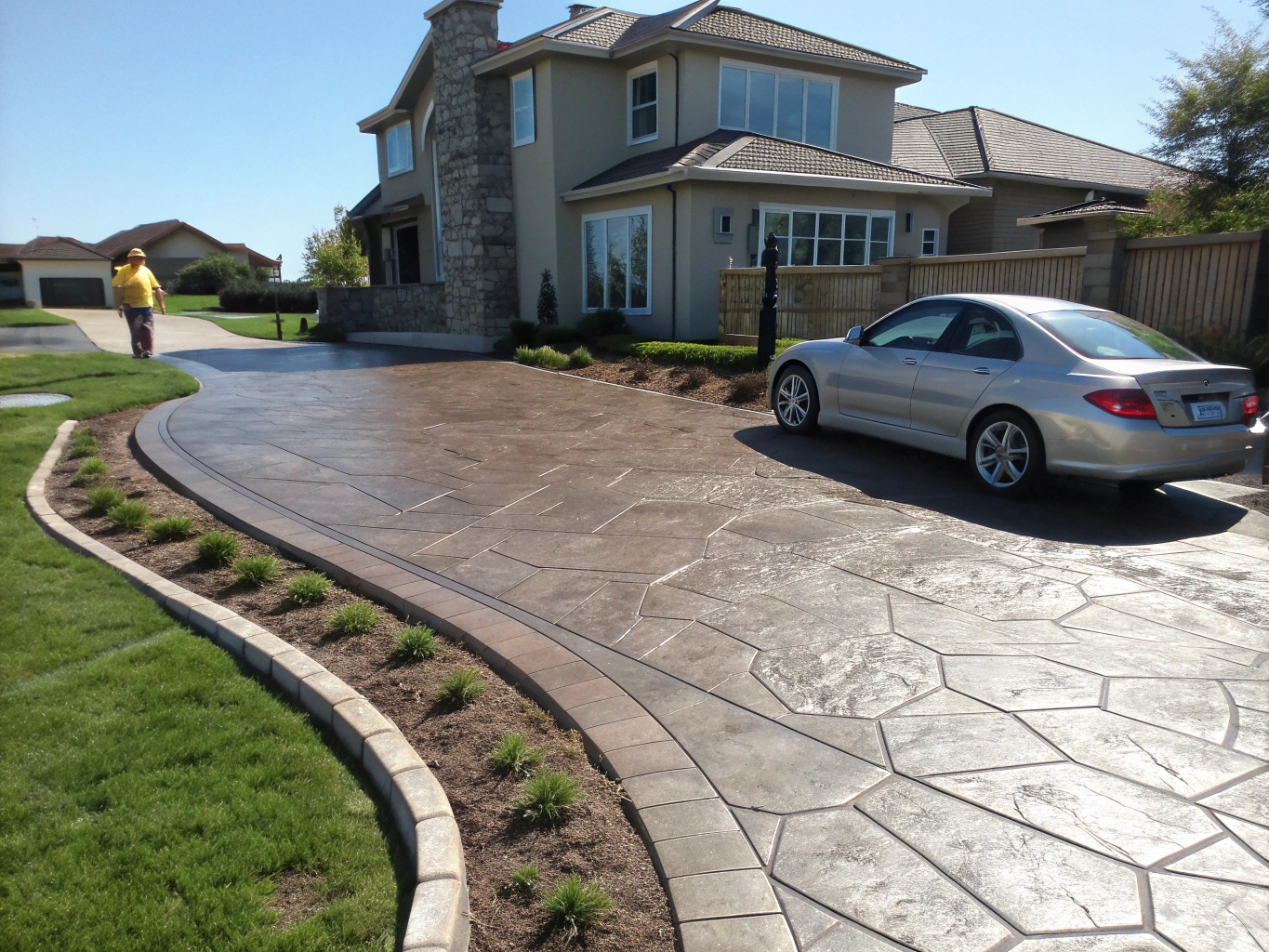 Quality decorative stamped concrete patio and driveway installation in Dickinson Texas